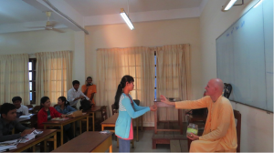 Fortunate students receiving prasadam